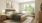 a bedroom with a bed and a plant