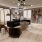 a lounge area with light wood floors