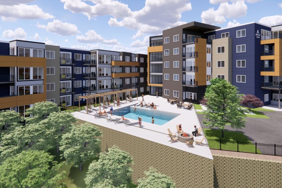 Modern apartment complex with a pool, lounge chairs, and people relaxing on a sunny day.